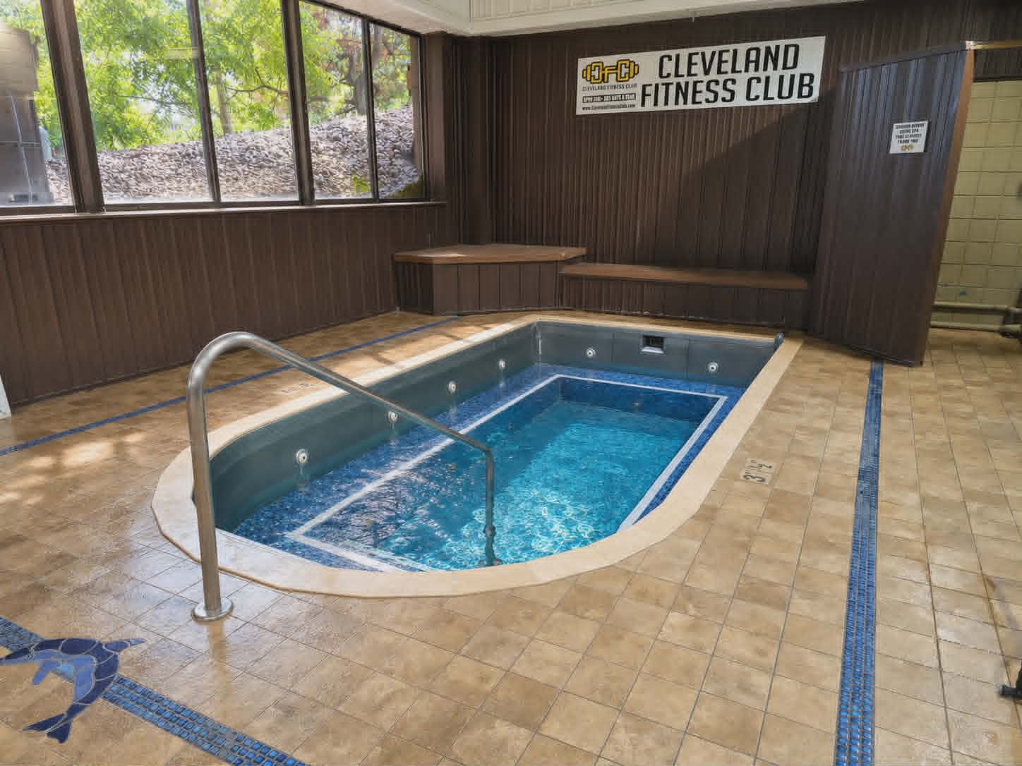 Hot tub and massage chairs relaxation area at Cleveland Fitness Club